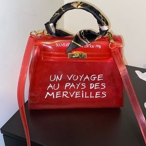 See-through pink handle bag